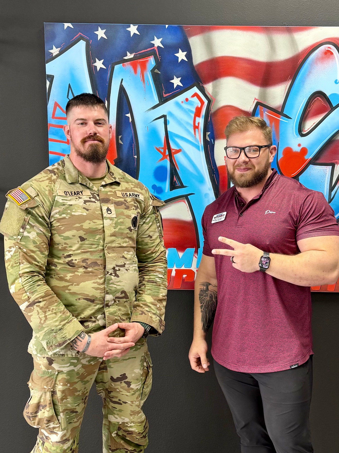 With a U.S. Army Staff Sergeant in front of the shop